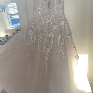 Never worn size 14 ivory allure romance ball gown.